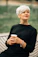 woman in black crew neck shirt holding white ceramic mug