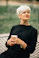 woman in black crew neck shirt holding white ceramic mug