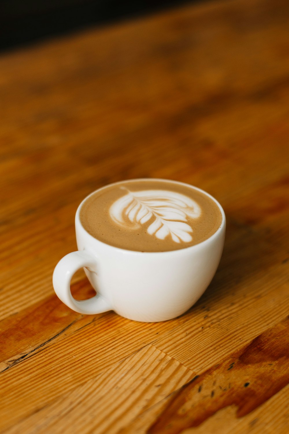 white ceramic cup with espresso