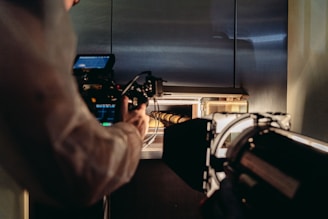 person holding black and gray audio mixer