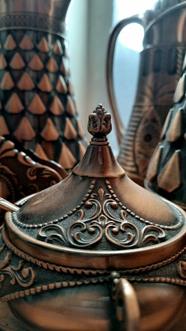 Close-up of intricately designed metalwork items.