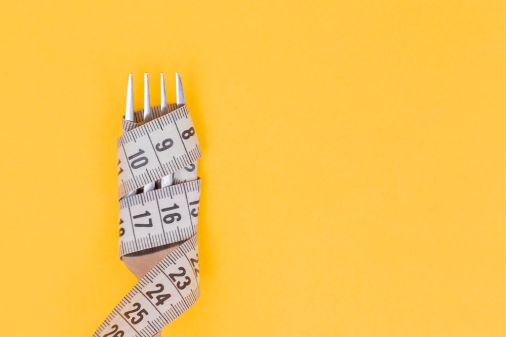 measuring tape and a fork - Soup Diet for Weight Loss 