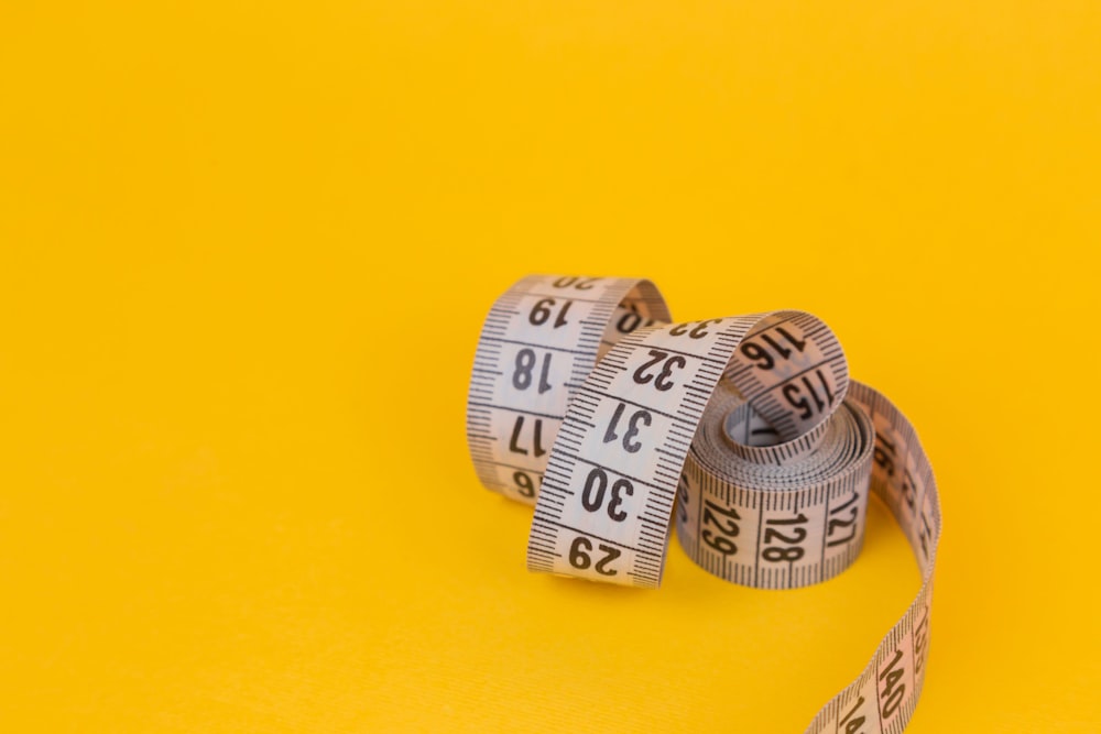 Fabric Measuring Tape In Yellow Stock Photo - Download Image Now