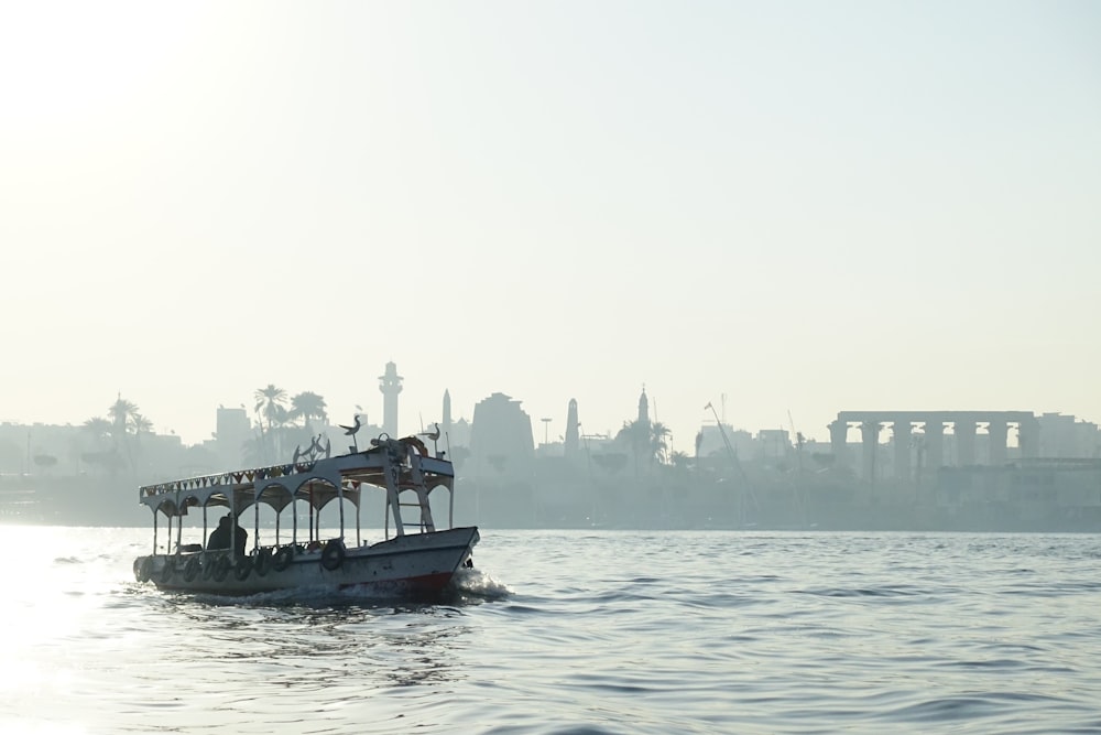 people riding on boat on sea during daytime