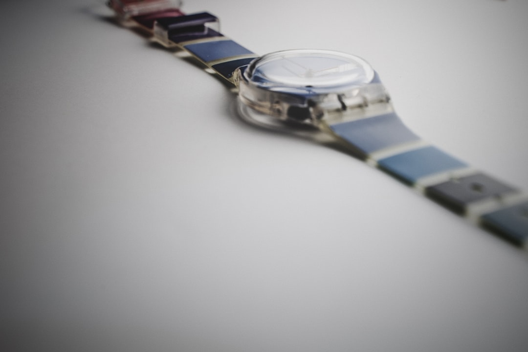 silver and blue round analog watch