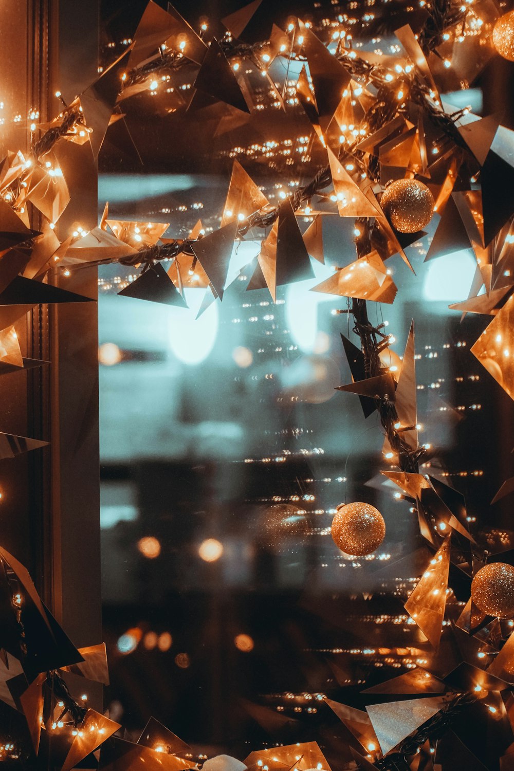 gold baubles on brown wooden frame