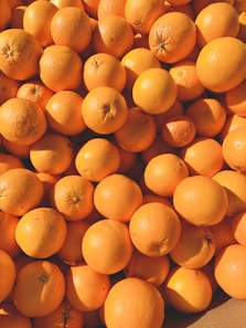 orange fruits on white ceramic plate