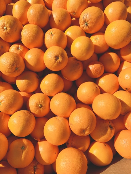 orange fruits on white ceramic plate