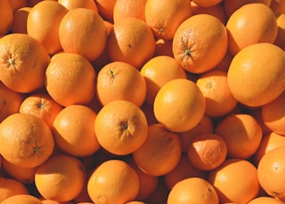 orange fruits on white ceramic plate