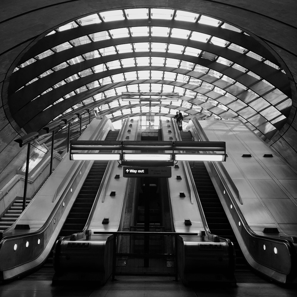 grayscale photo of a train station