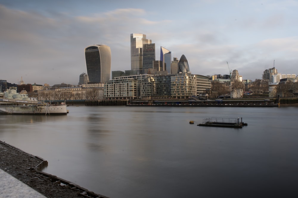 city skyline across body of water during daytime