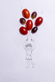 red cherry fruit on white surface