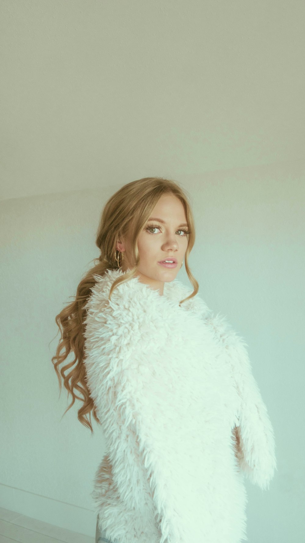 girl in white fur coat