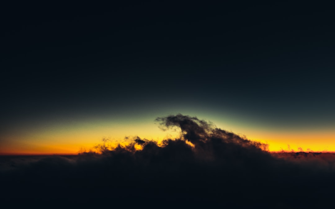 silhouette of mountain during sunset