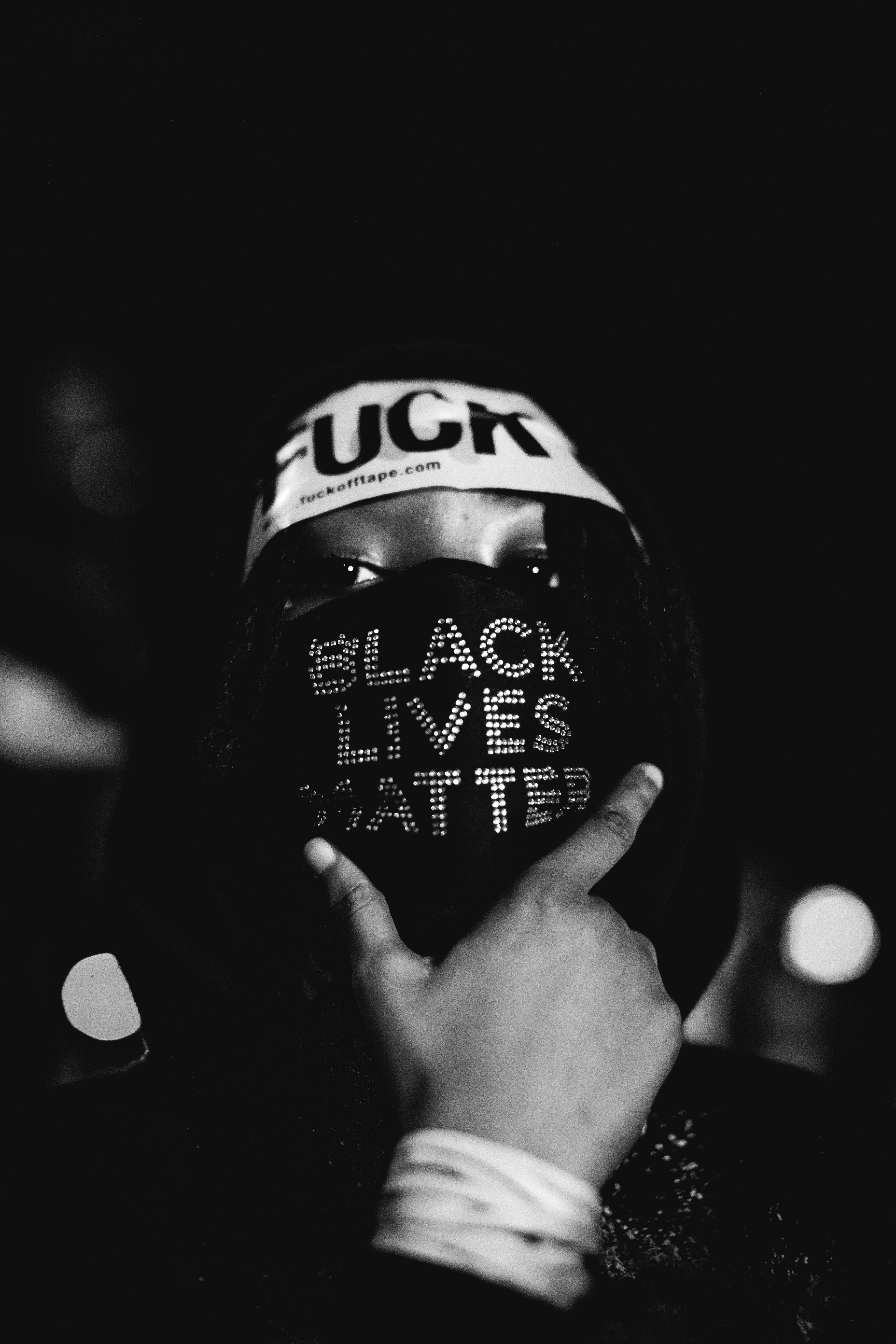 a person wearing a black lives matter helmet