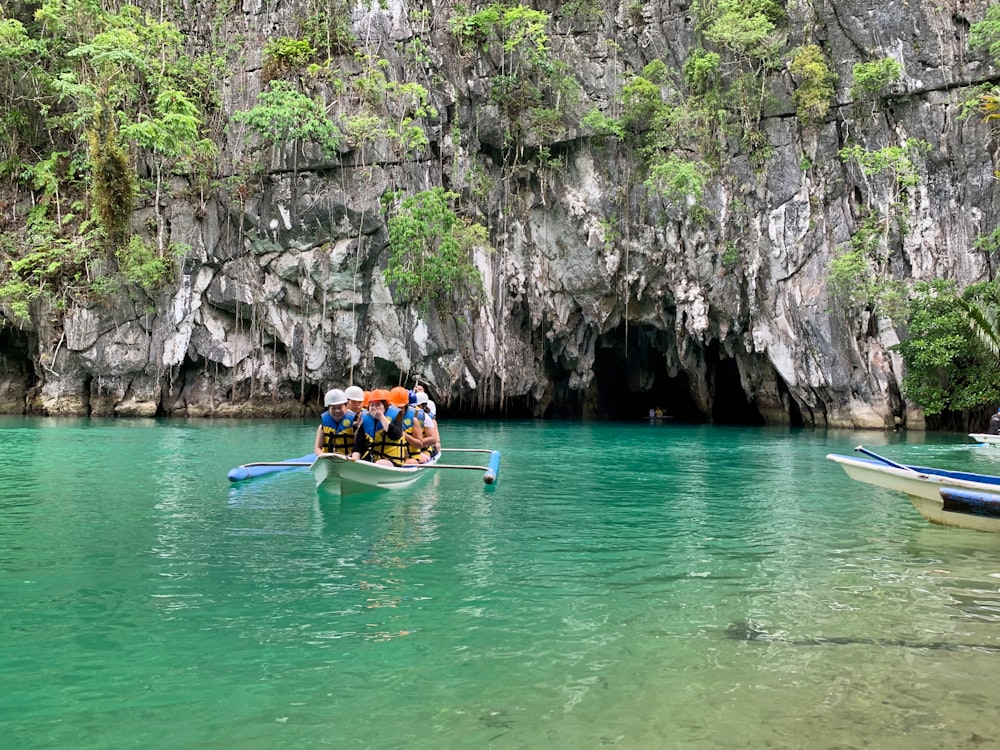 people riding on kayak on river during daytime