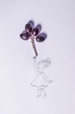 A whimsical illustration of a girl holding a bunch of grapes as if they are balloons, with the grapes attached by a small vine. The girl's hair flows as if she is being lifted gently by the grapes.