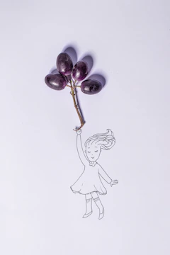 A whimsical sketch of a little girl holding a bunch of balloons floating above a green meadow.