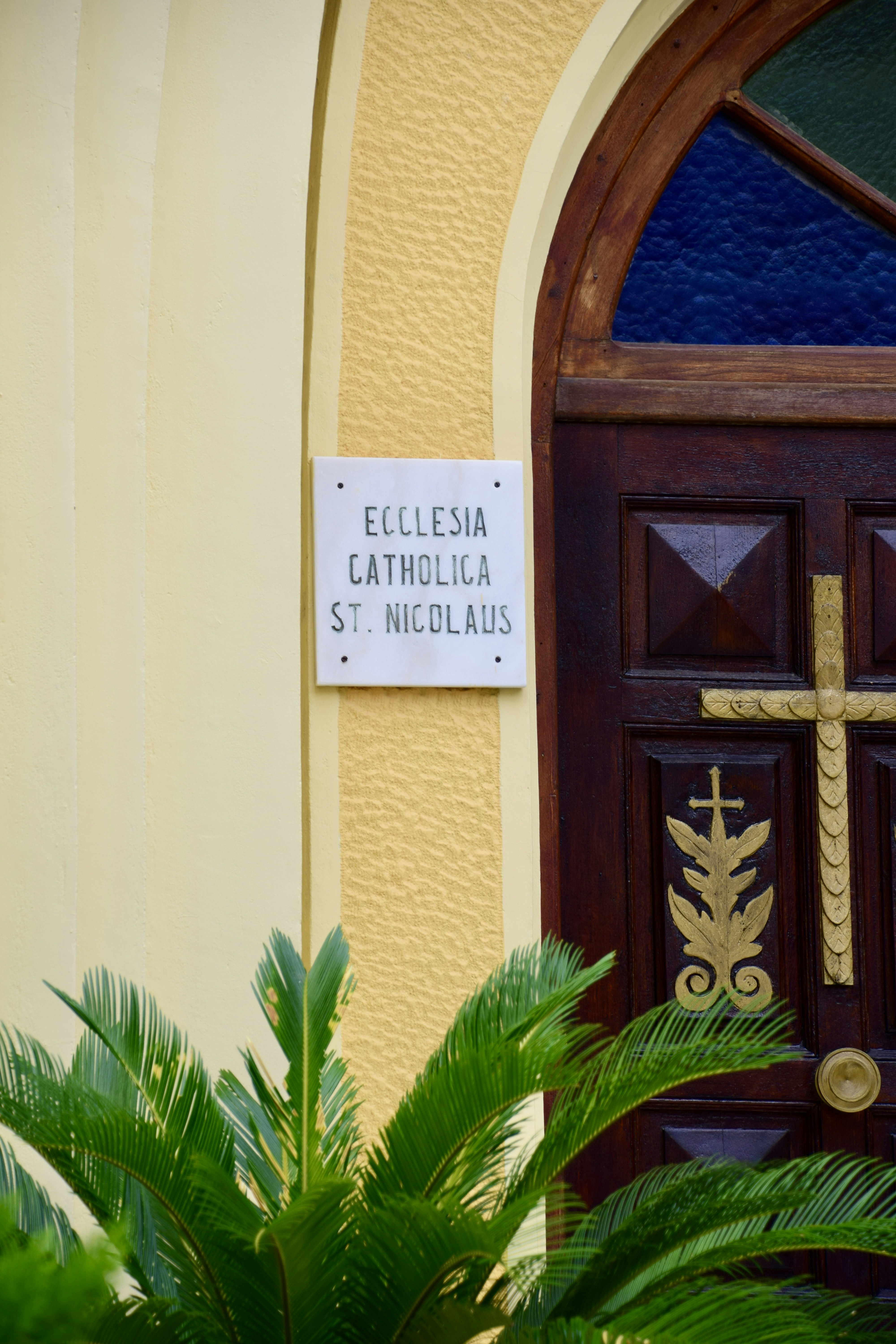 brown wooden door with white and black quote