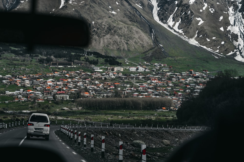 white van on road near mountain during daytime