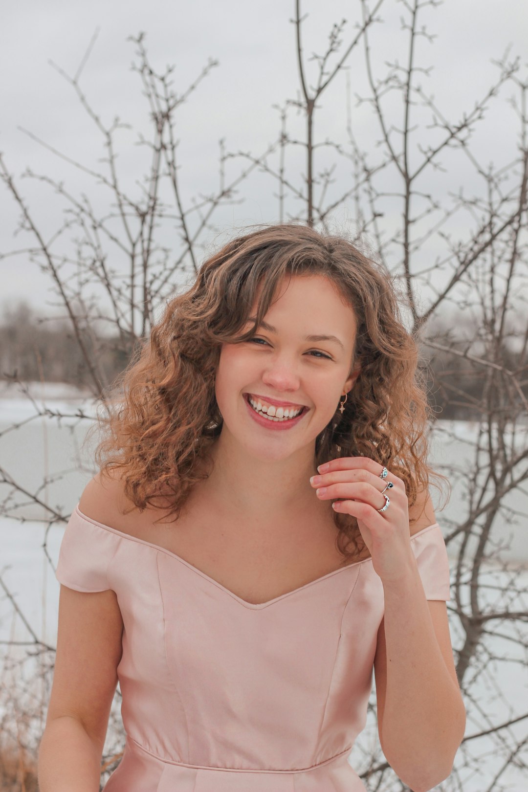 smiling woman in white scoop neck shirt