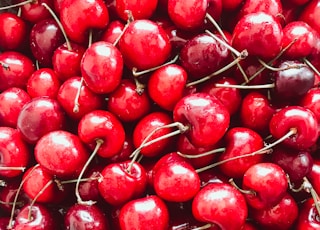 red cherries in close up photography