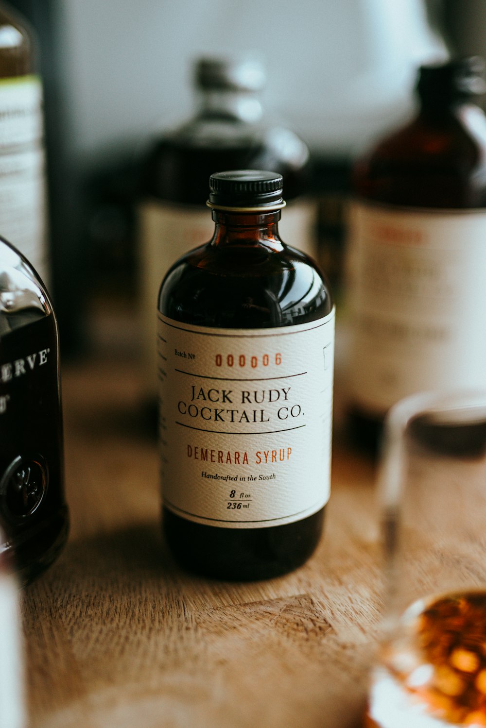 a bottle of alcohol sitting on top of a wooden table