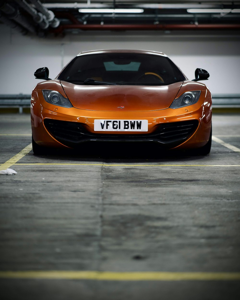 orange porsche 911 on road