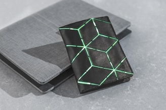 black and green box on black table