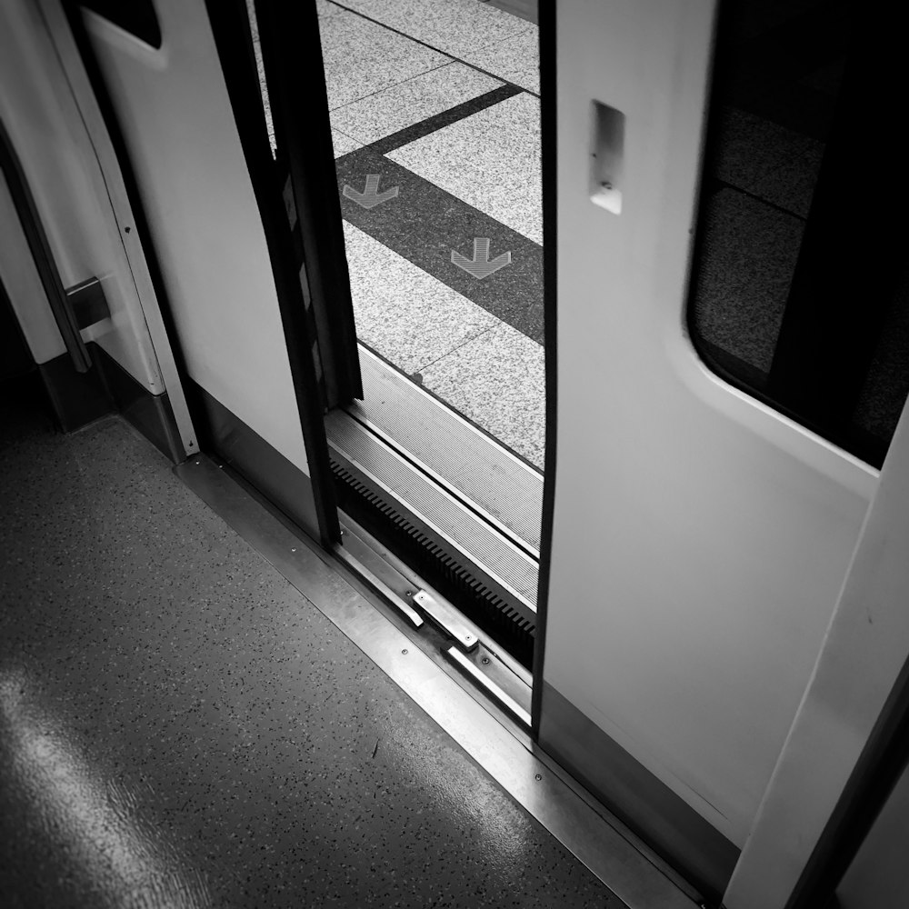 gray scale photo of a train