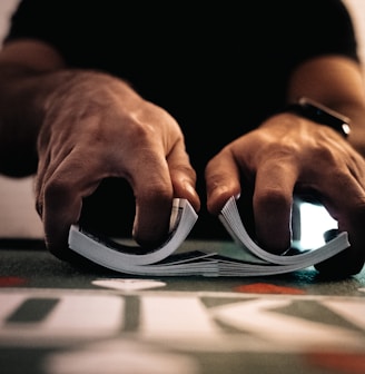 person wearing silver ring on macbook pro