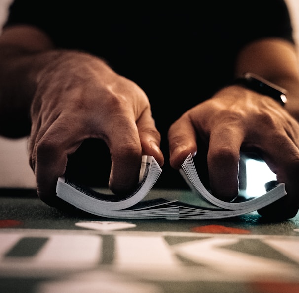 person wearing silver ring on macbook pro