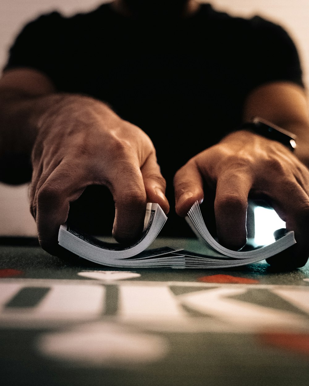 person wearing silver ring on macbook pro