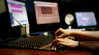 person using black and white computer keyboard