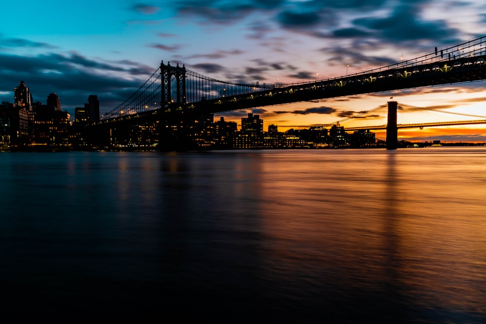 bridge over water during night time