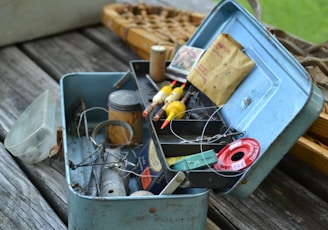 blue plastic container with yellow and red plastic bottle