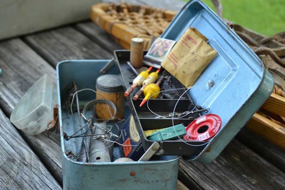 blue plastic container with yellow and red plastic bottle