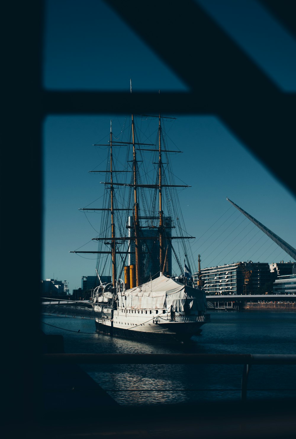 white and black ship on dock during night time