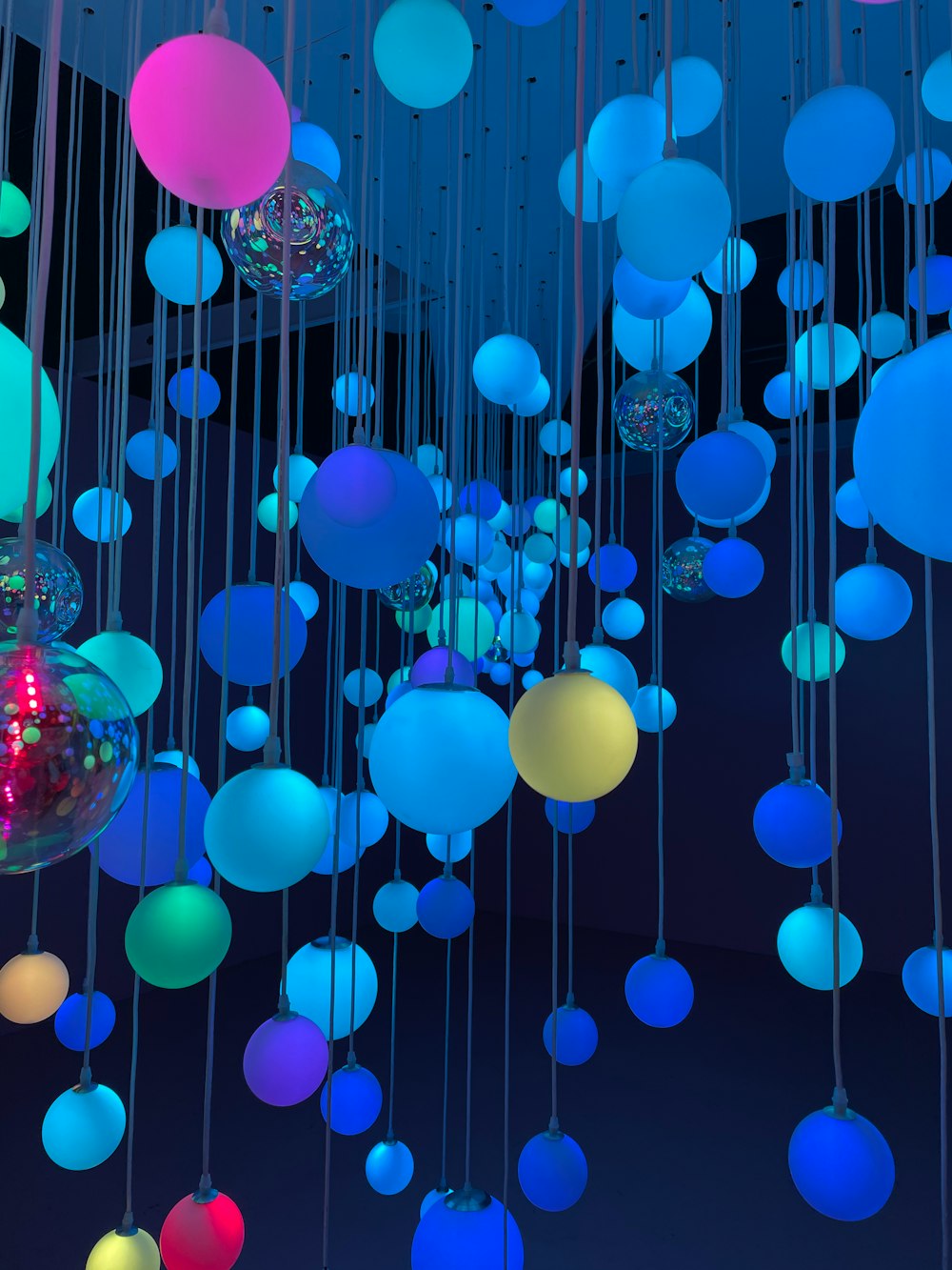 blue and pink balloons with water droplets