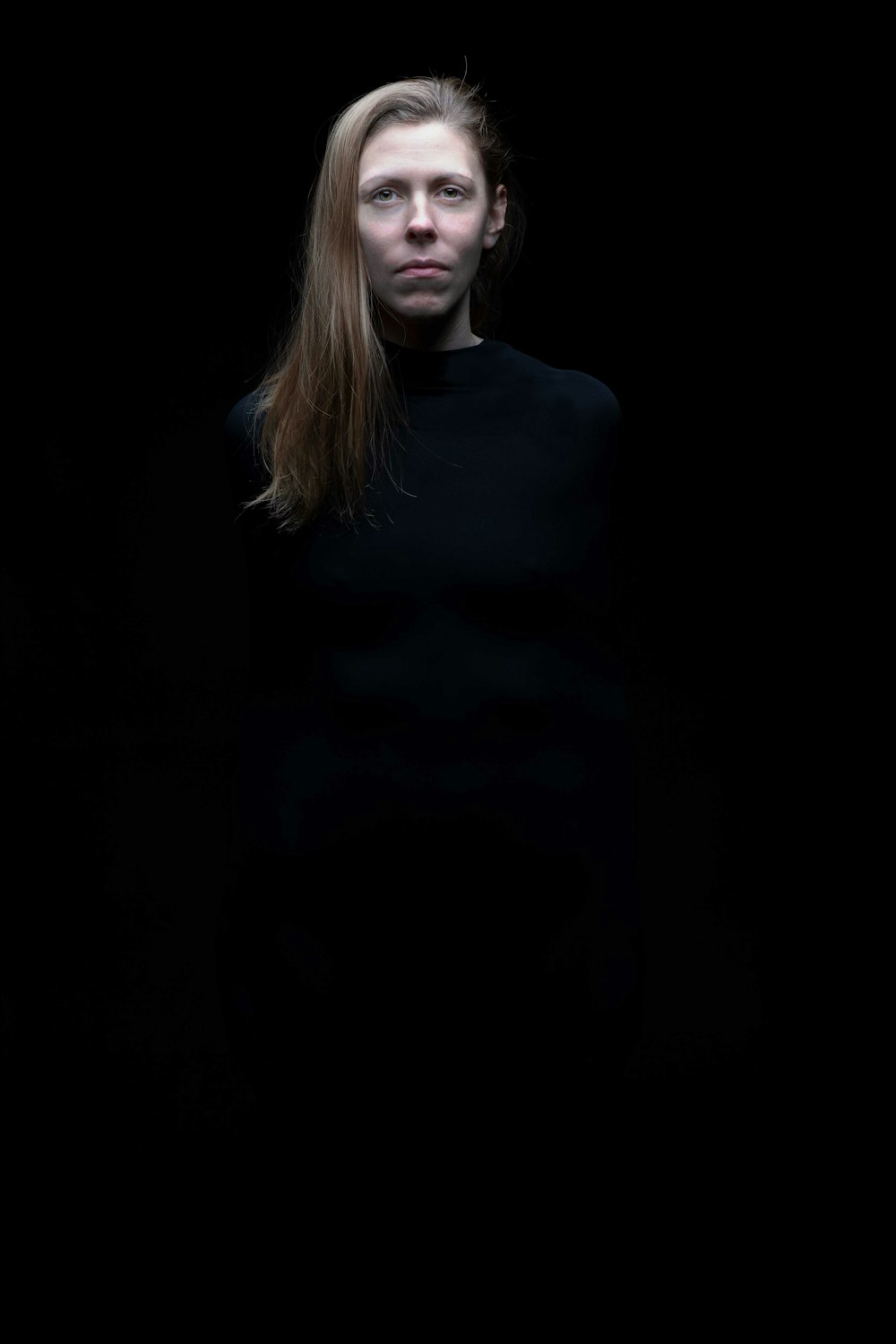 woman in black turtleneck long sleeve shirt