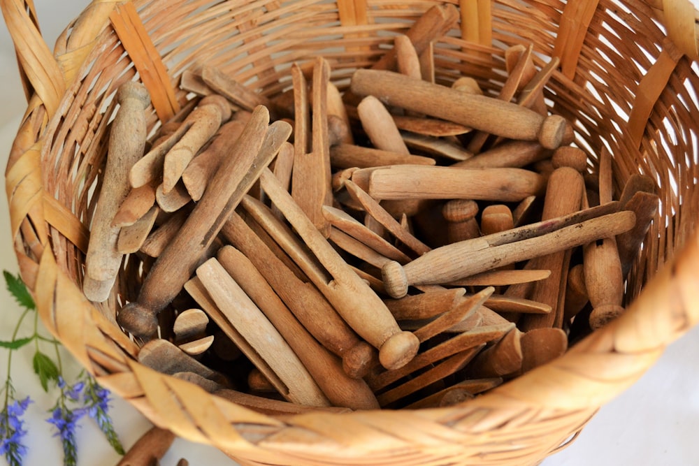 brown wooden sticks on brown woven basket