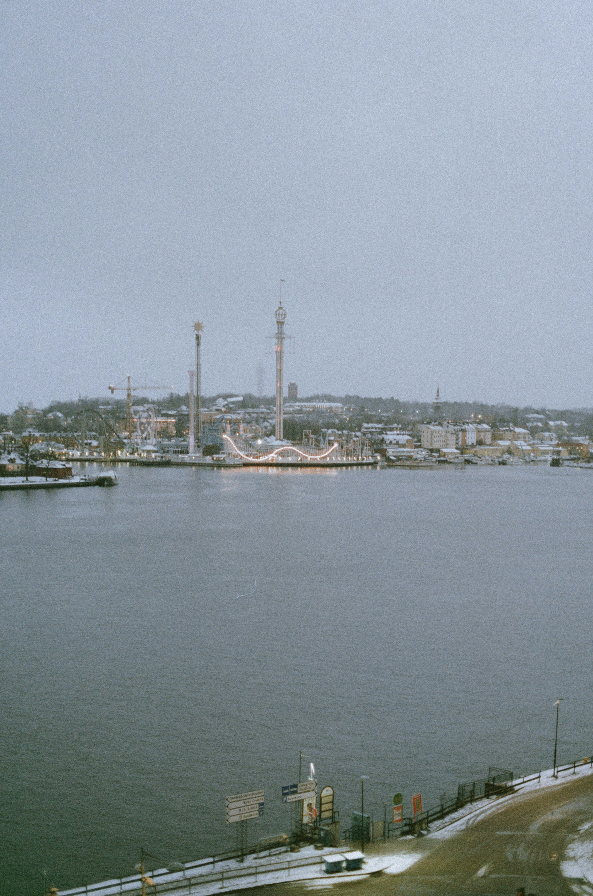 white and brown boat on body of water during daytime