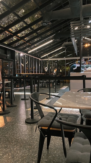 A modern cafe with automated glass systems installed by Astana Tent.