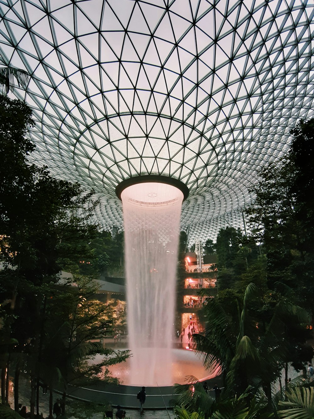 water fountain in the middle of trees