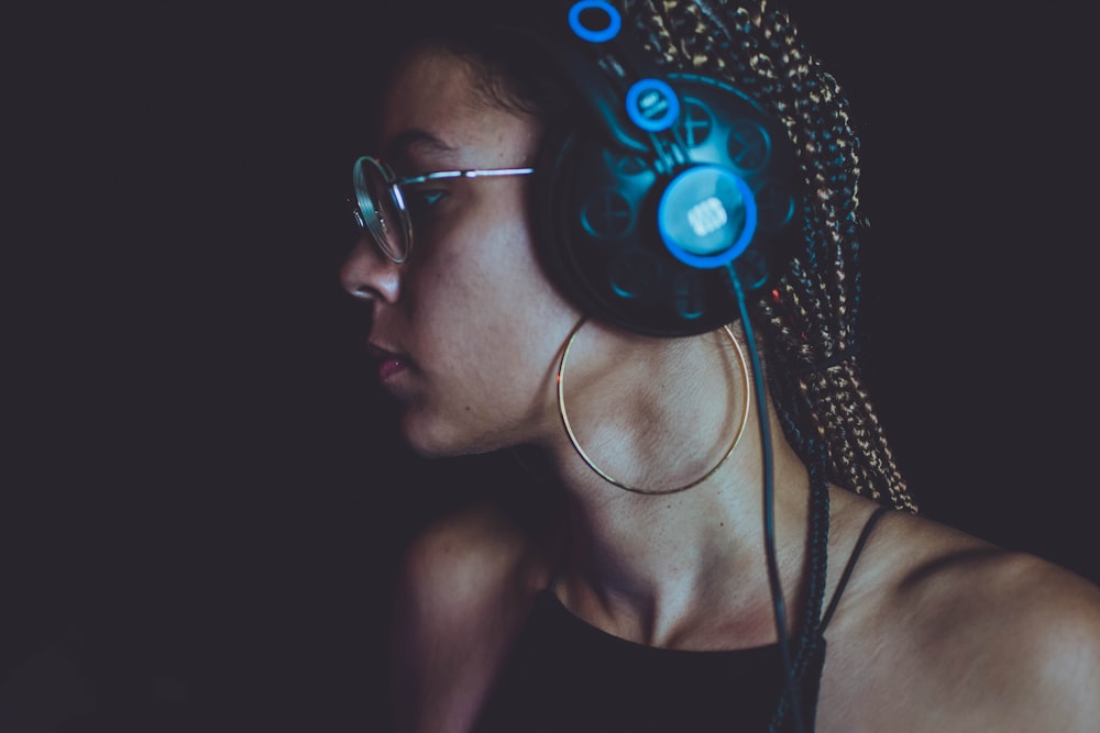 woman with blue and black headphones
