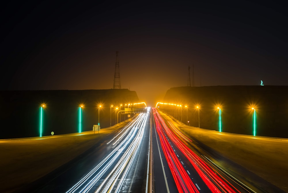 time lapse photography of cars on road during night time