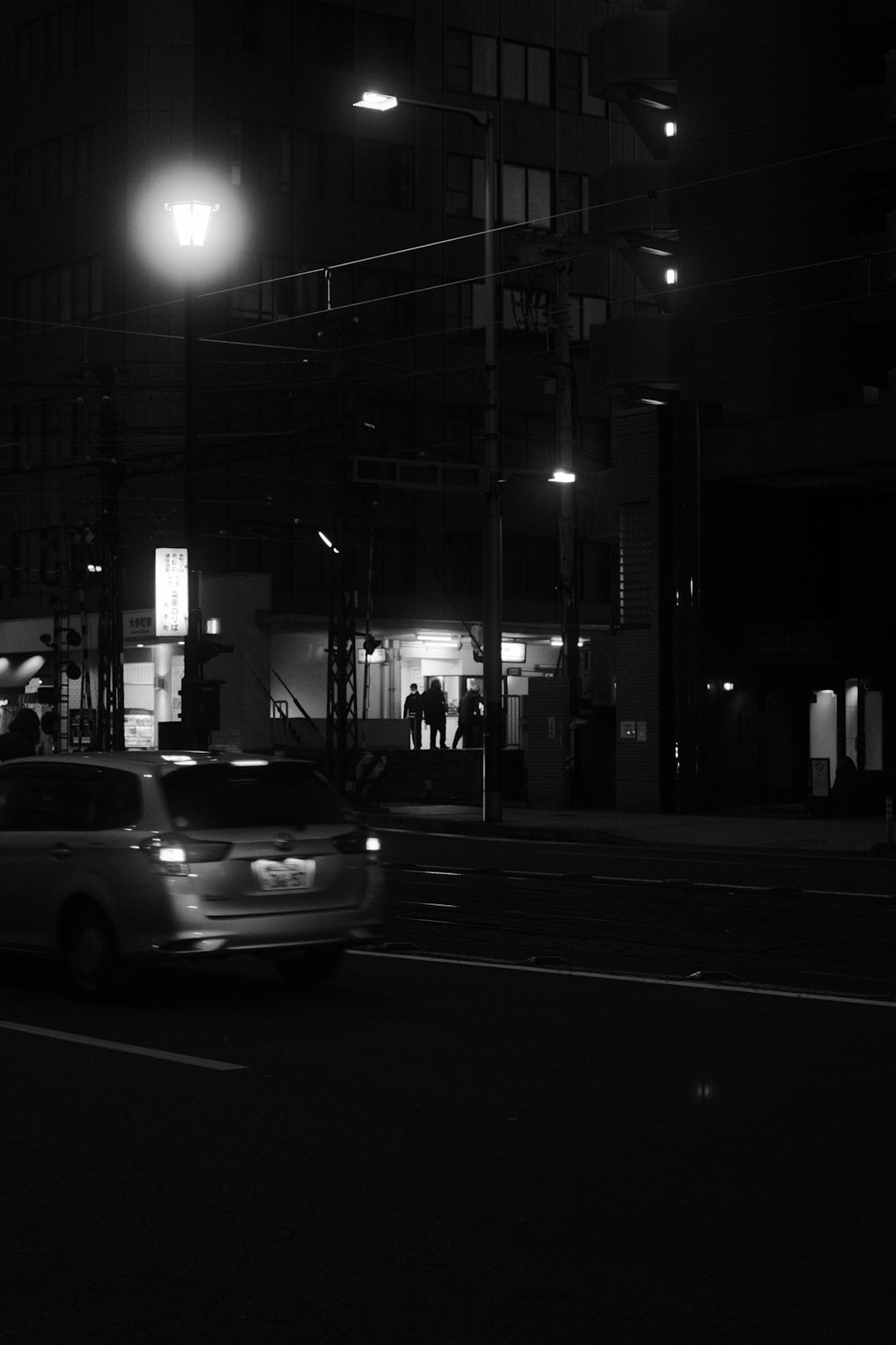 grayscale photo of cars on road