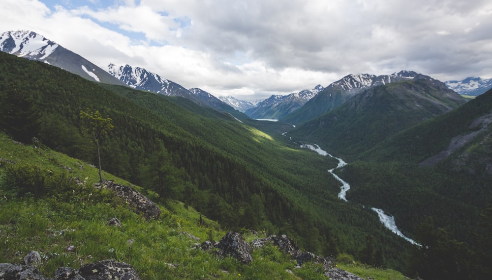 green mountains under white clouds during daytime