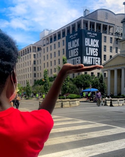 Kenya Wade standing with community leaders, united in purpose under a bright Louisville sky.