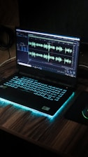 black laptop computer on brown wooden table